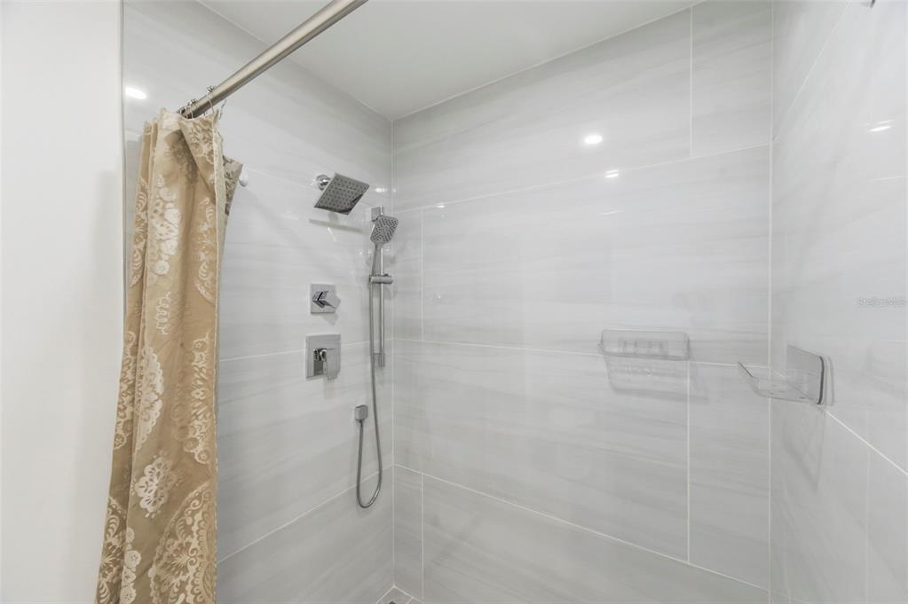 10810 Freedom Drive Port Richey, FL 34668 - Photo 27 of 65 a bathroom with a shower