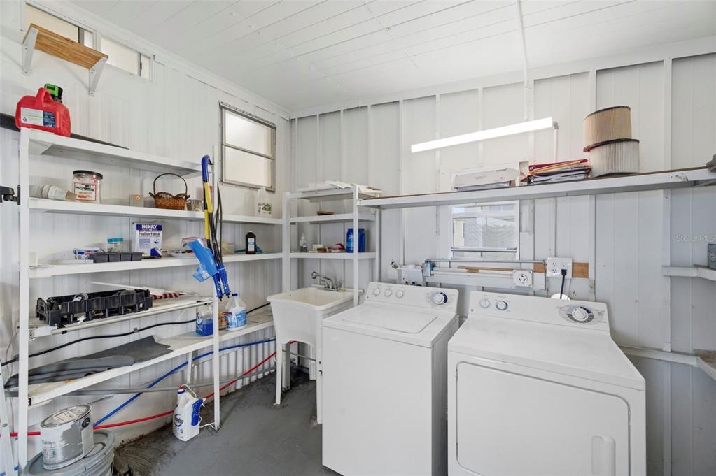 10810 Freedom Drive Port Richey, FL 34668 - Photo 31 of 65 a view of washer and dryer in a kitchen