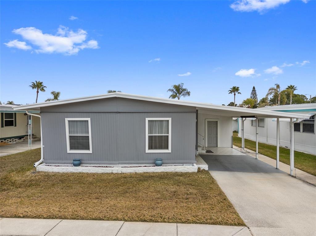 10810 Freedom Drive Port Richey, FL 34668 - Photo 33 of 65 a view of a house with a yard
