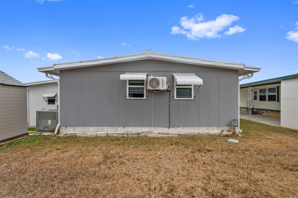 10810 Freedom Drive Port Richey, FL 34668 - Photo 35 of 65 a house view with a backyard space