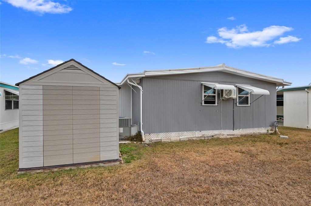 10810 Freedom Drive Port Richey, FL 34668 - Photo 37 of 65 a front view of a house with a garage