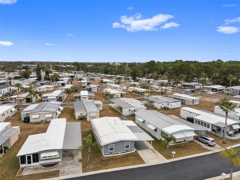 10810 Freedom Drive Port Richey, FL 34668 - Photo 38 of 65 an aerial view of residential houses and outdoor space