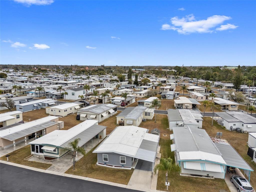 10810 Freedom Drive Port Richey, FL 34668 - Photo 40 of 65 an aerial view of residential houses with outdoor space
