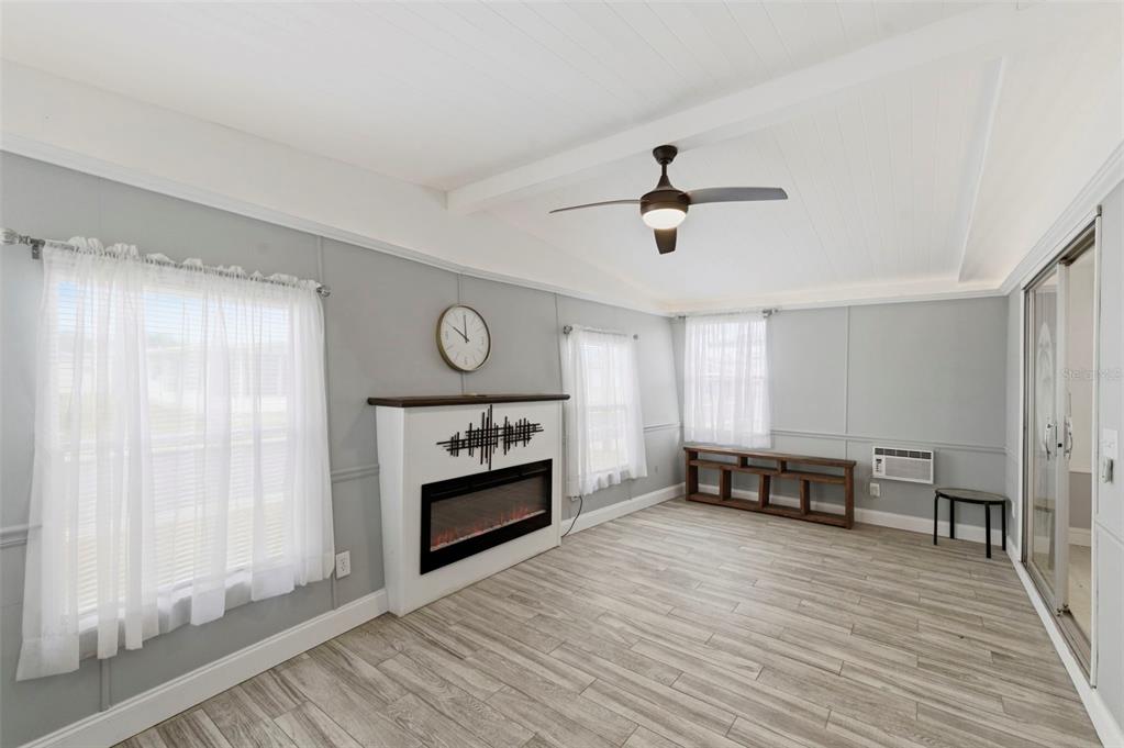 10810 Freedom Drive Port Richey, FL 34668 - Photo 5 of 65 a view of a livingroom with furniture and a ceiling fan
