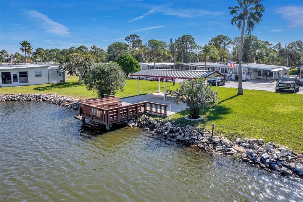 10810 Freedom Drive Port Richey, FL 34668 - Photo 56 of 65 a view of a house with a yard