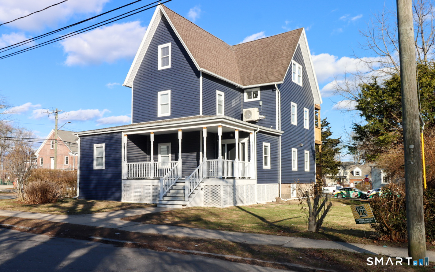 55 Channing Street, Unit 2 New London, CT 06320 - Photo 1 of 19 a front view of a house with a yard