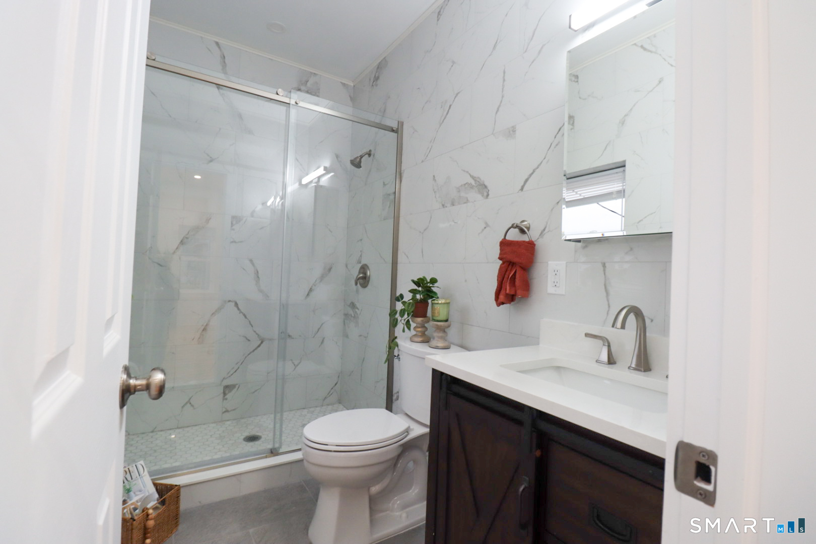 55 Channing Street, Unit 2 New London, CT 06320 - Photo 12 of 19 a bathroom with a sink a toilet and shower