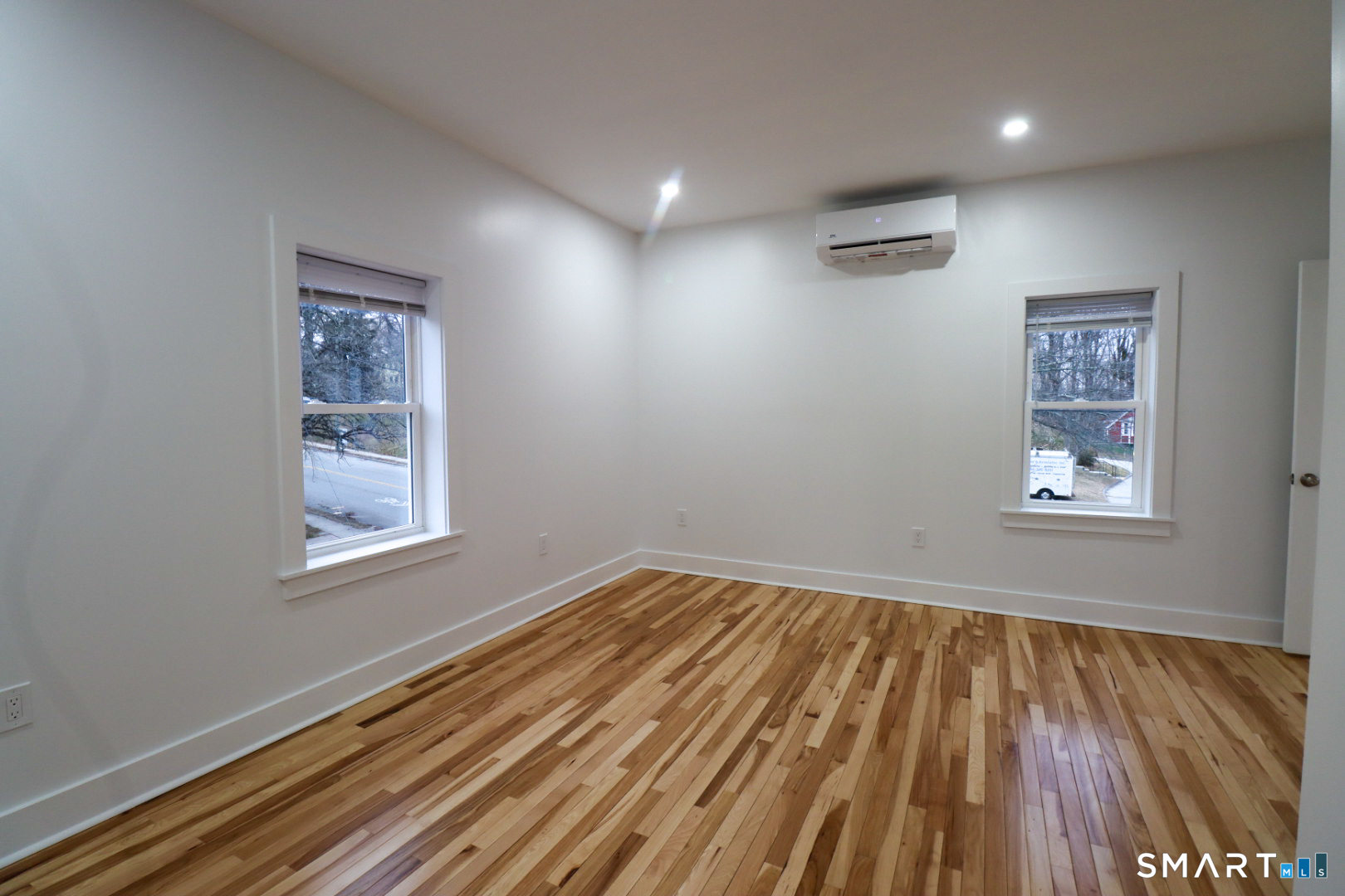 55 Channing Street, Unit 2 New London, CT 06320 - Photo 14 of 19 a view of a room with wooden floor and windows