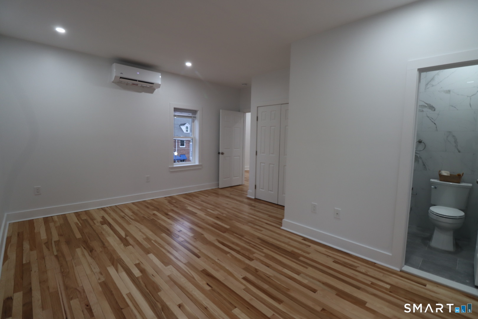 55 Channing Street, Unit 2 New London, CT 06320 - Photo 15 of 19 a view of a room with wooden floor and bathroom