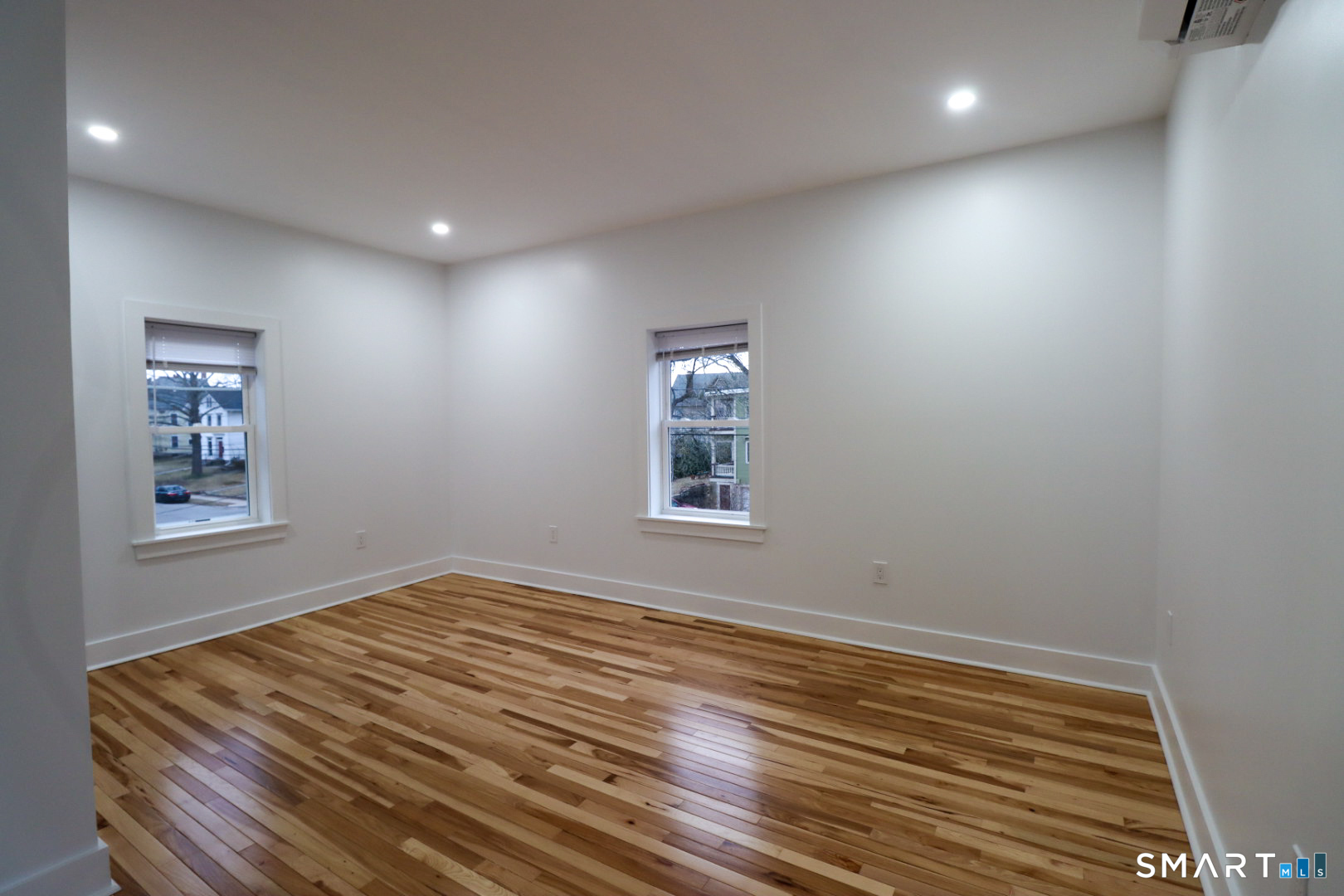 55 Channing Street, Unit 2 New London, CT 06320 - Photo 16 of 19 a view of room with window and wooden floor