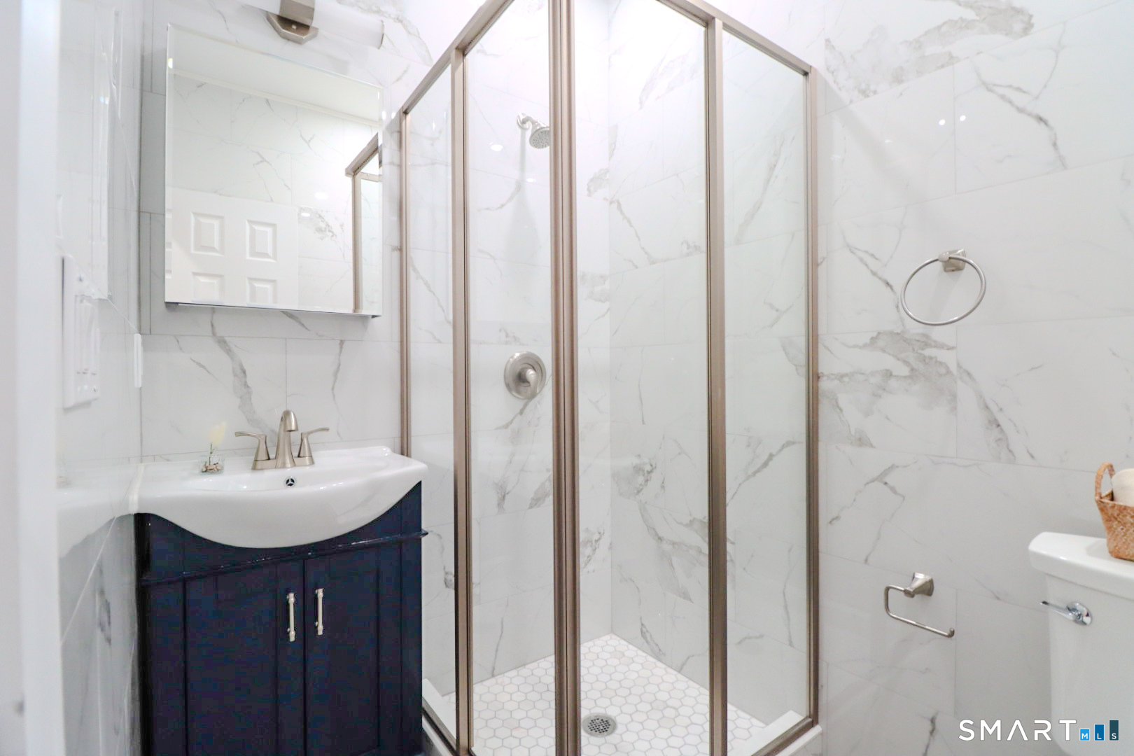 55 Channing Street, Unit 2 New London, CT 06320 - Photo 17 of 19 a bathroom with a sink a toilet and shower