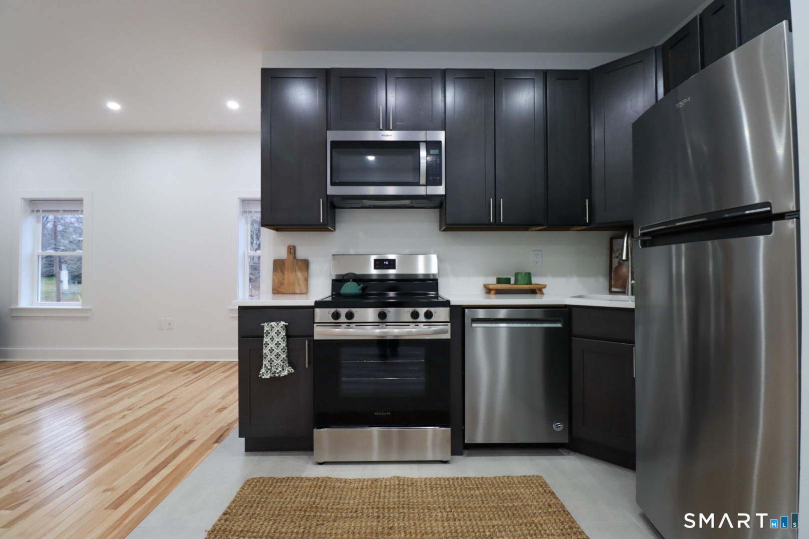 55 Channing Street, Unit 2 New London, CT 06320 - Photo 4 of 19 a kitchen with stainless steel appliances granite countertop a refrigerator and a sink