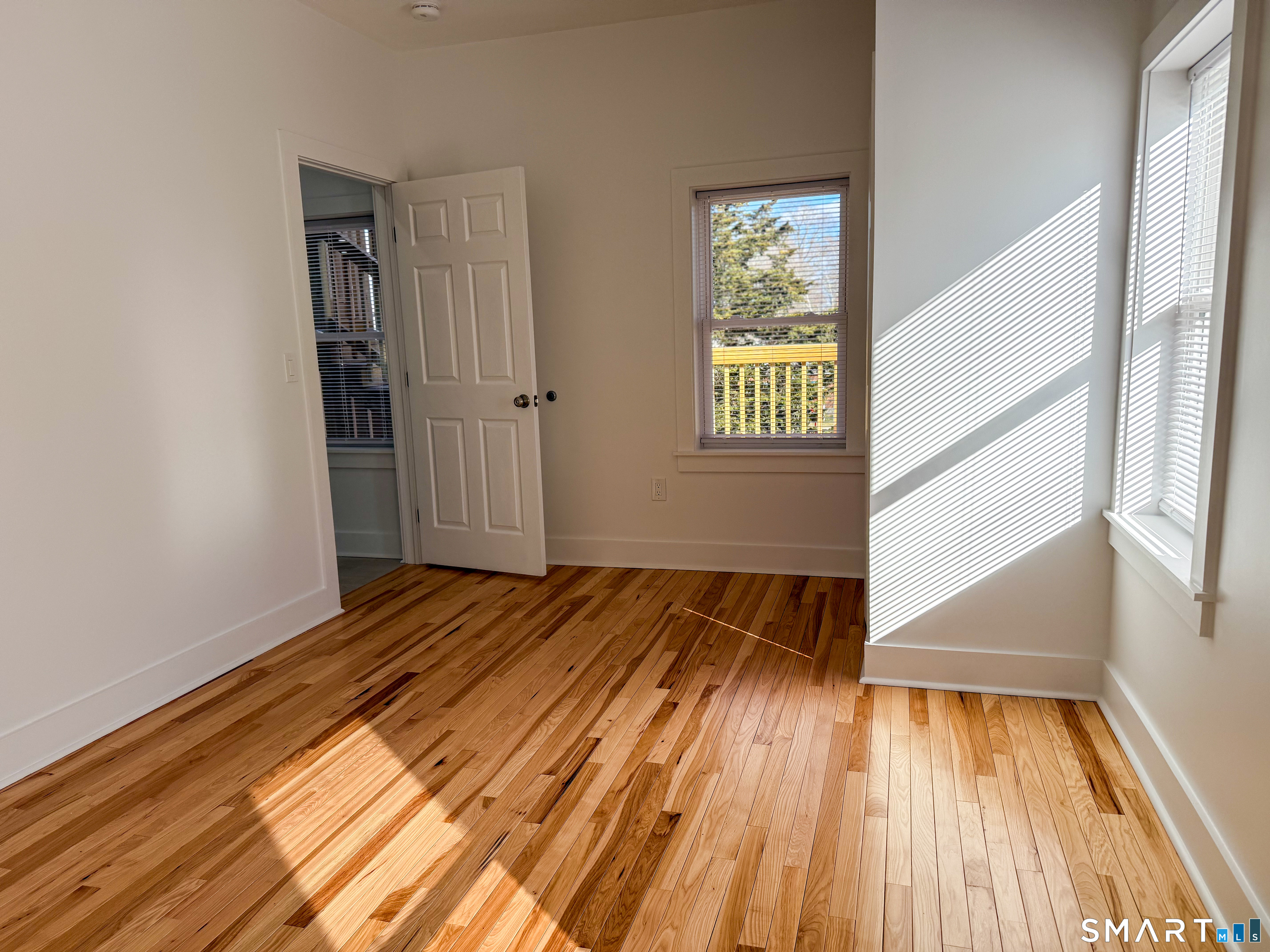 55 Channing Street, Unit 2 New London, CT 06320 - Photo 8 of 19 a view of an empty room and wooden floor