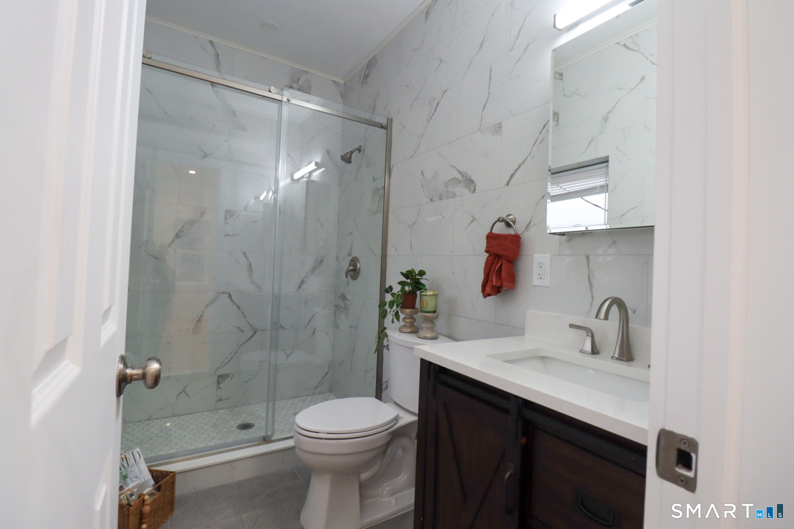 55 Channing Street, Unit 2 New London, CT 06320 - Photo 9 of 19 a bathroom with a sink a toilet and shower