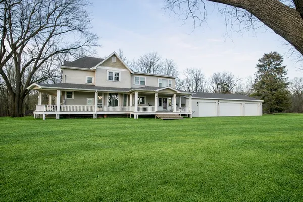 a view of a house with a big yard