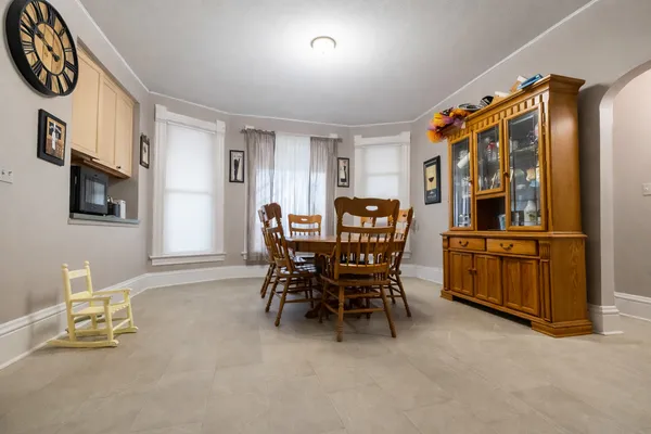 a dining room with furniture and window