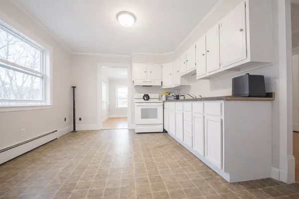 a view of a kitchen with electric appliances