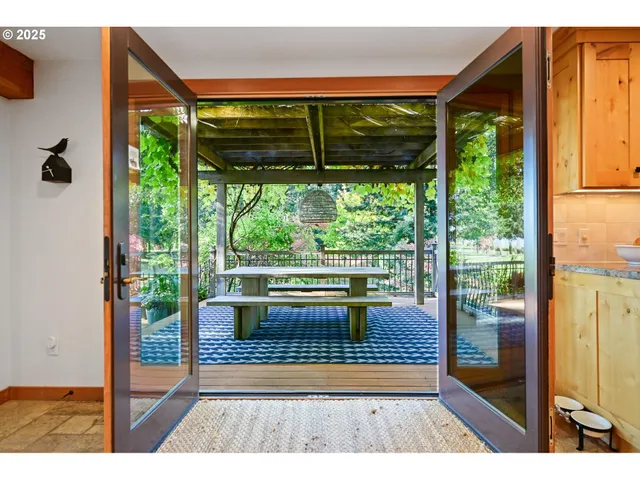 a view of a chairs and table in the balcony