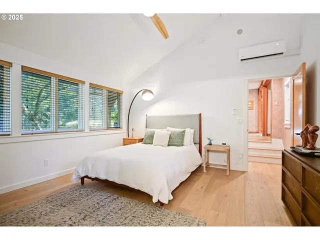a bathroom with a shower sink and mirror