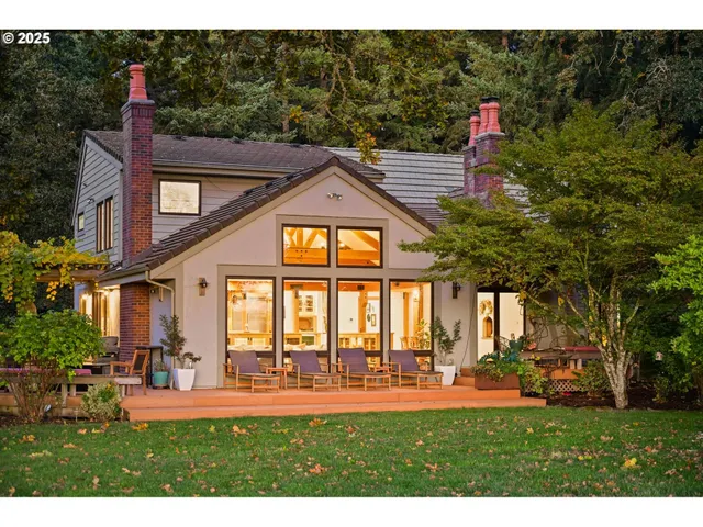 a view of a backyard with sitting area
