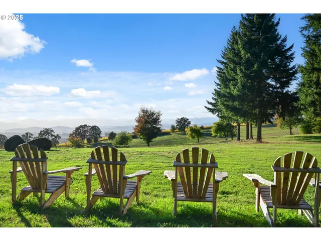 a view of a house with a yard and wooden floor