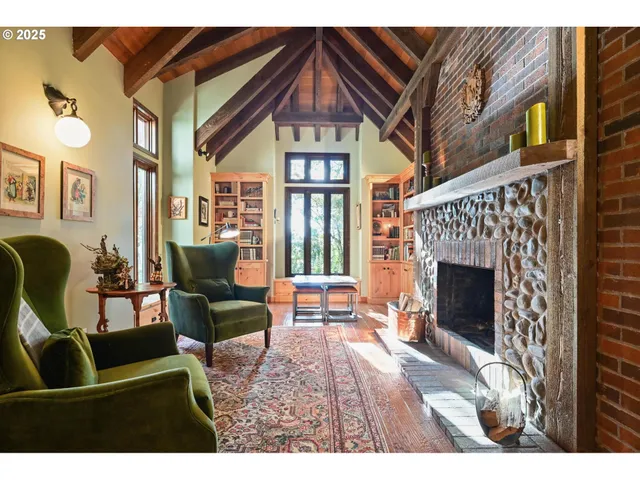 a dining room with furniture a chandelier and wooden floor