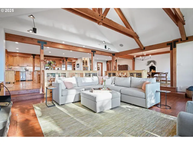 a living room with furniture wooden floor and a fireplace