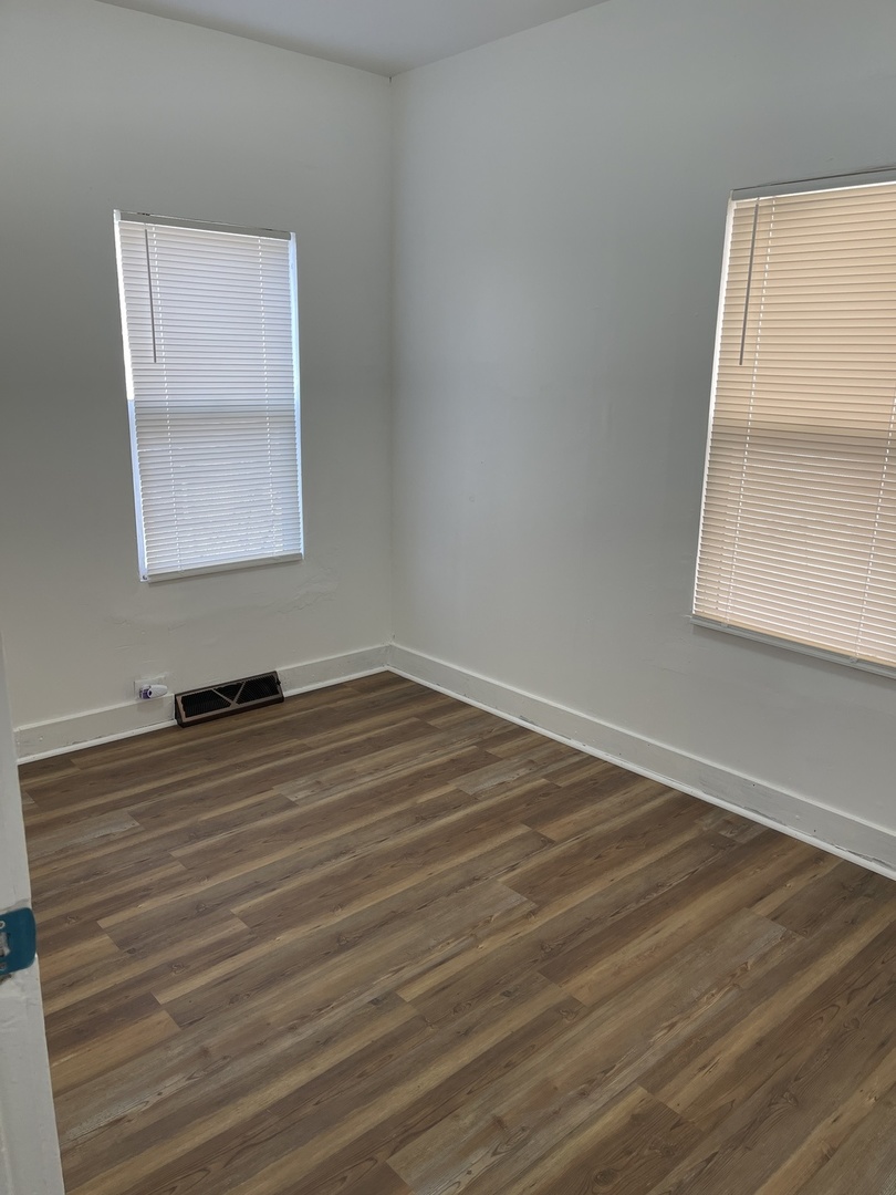 271 East 148th Street Harvey, IL 60426 - Photo 4 of 7 wooden floor in an empty room
