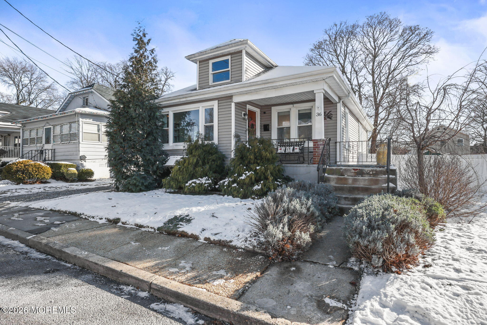 36 Cherry Street Tinton Falls, NJ 07724 - Photo 1 of 31 a front view of a house with a yard and garage