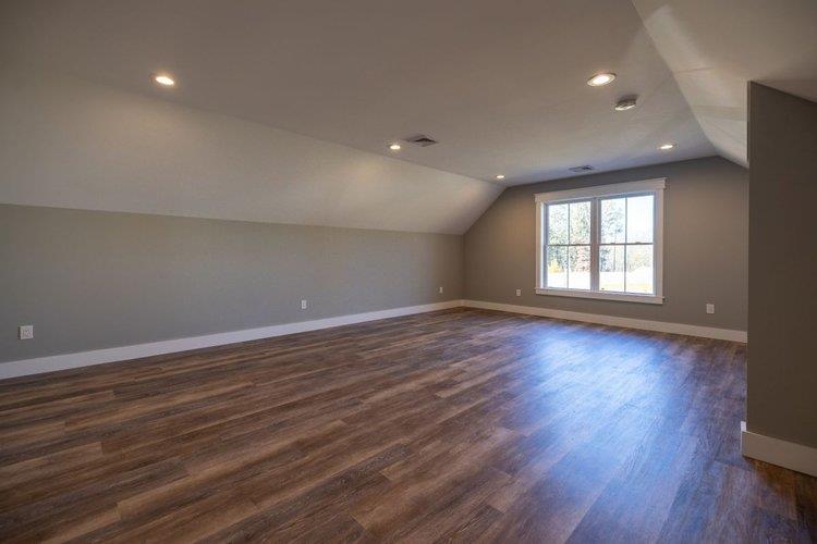 217 Old Hopewell Road Wappingers Falls, NY 12590 - Photo 14 of 17 an empty room with wooden floor and windows