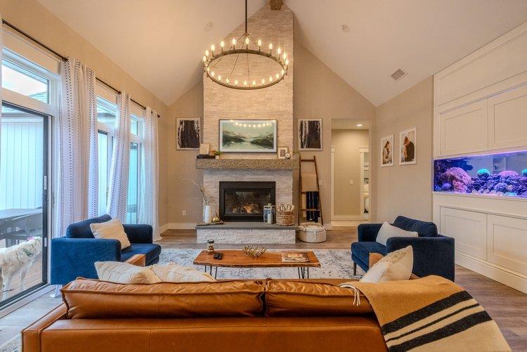 217 Old Hopewell Road Wappingers Falls, NY 12590 - Photo 7 of 17 a living room with furniture a fireplace and a chandelier