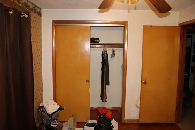 a bed room with a bed and a lamp