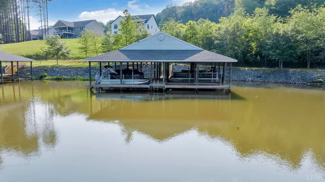 a house with swimming pool in front of it