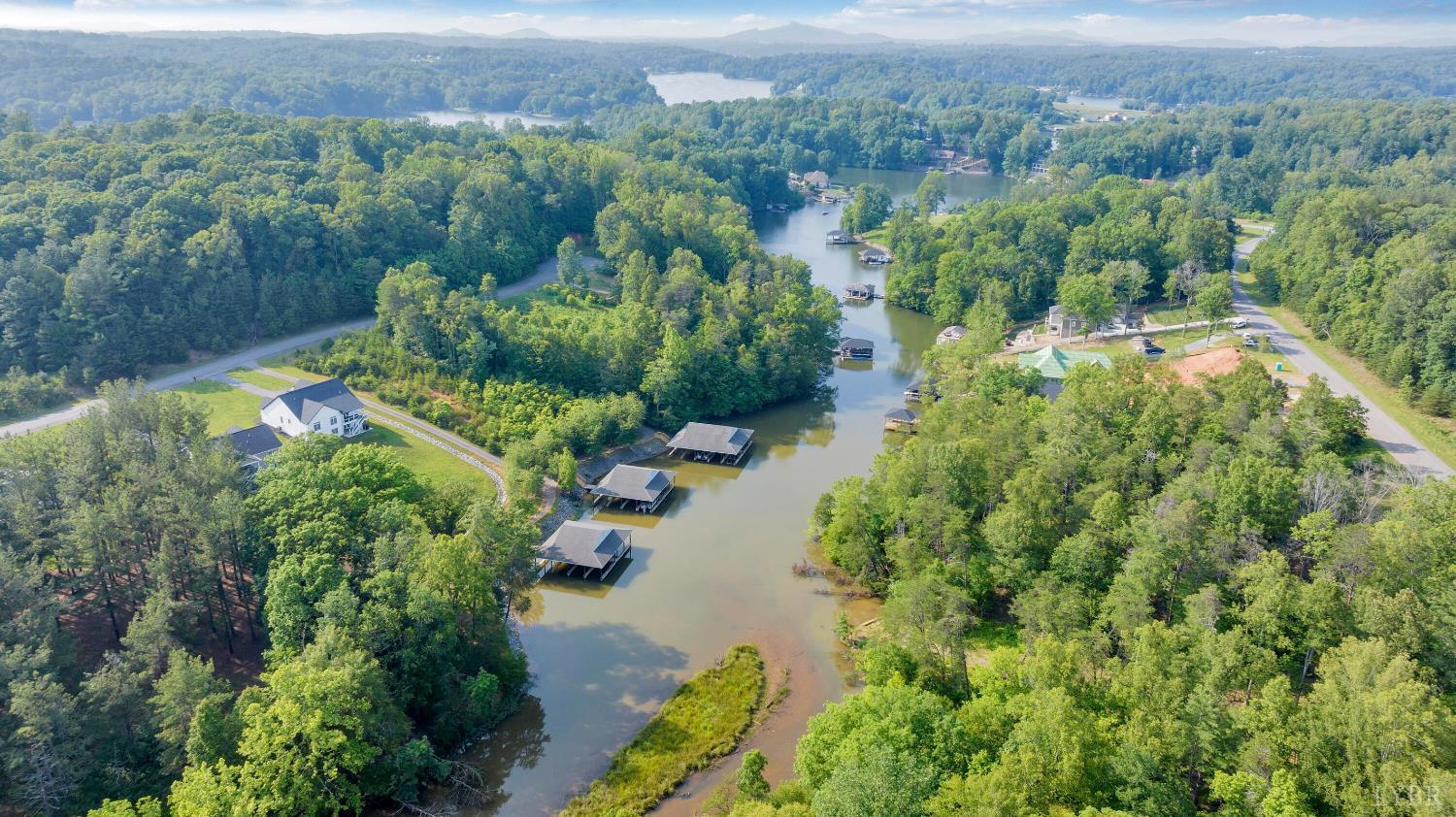 0 Watchtower Drive Moneta, VA 24121 - Photo 6 of 28 an aerial view of green landscape with trees houses and mountain view