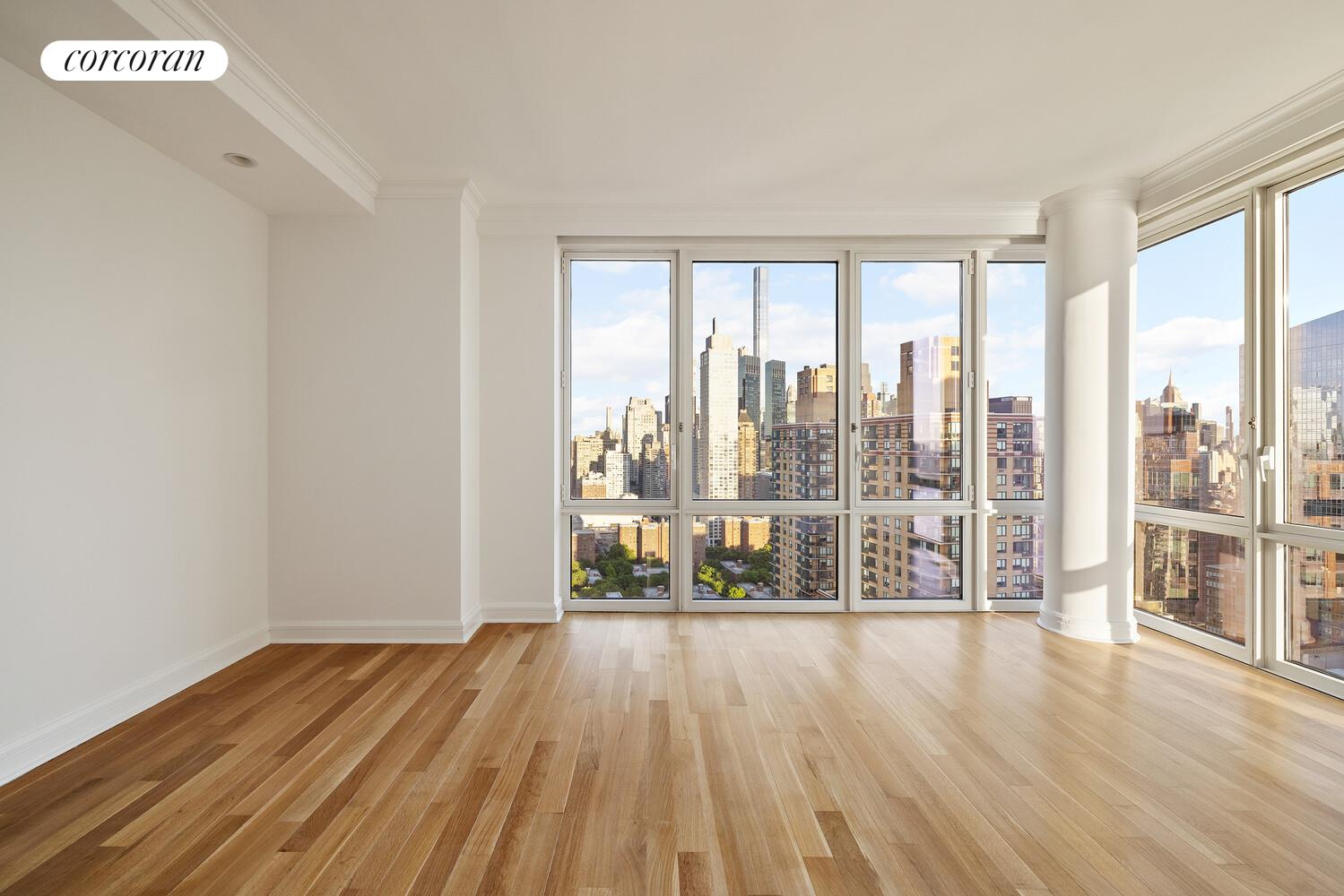 80 Riverside Boulevard, Unit 36B Manhattan, NY 10069 - Photo 9 of 25 a view of an empty room with wooden floor and a window