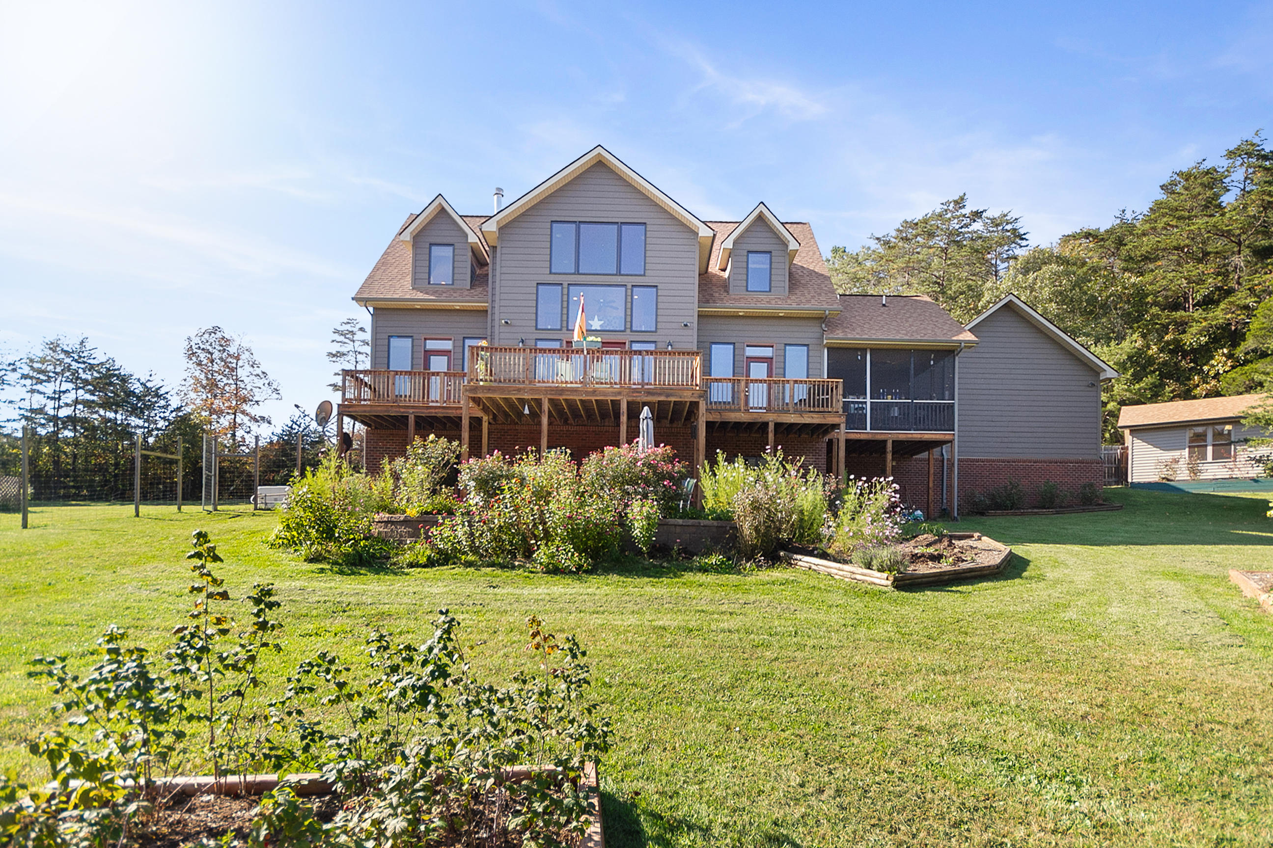 3950 Flatwoods Road Elliston, VA 24087 - Photo 2 of 94 a front view of a house with a yard