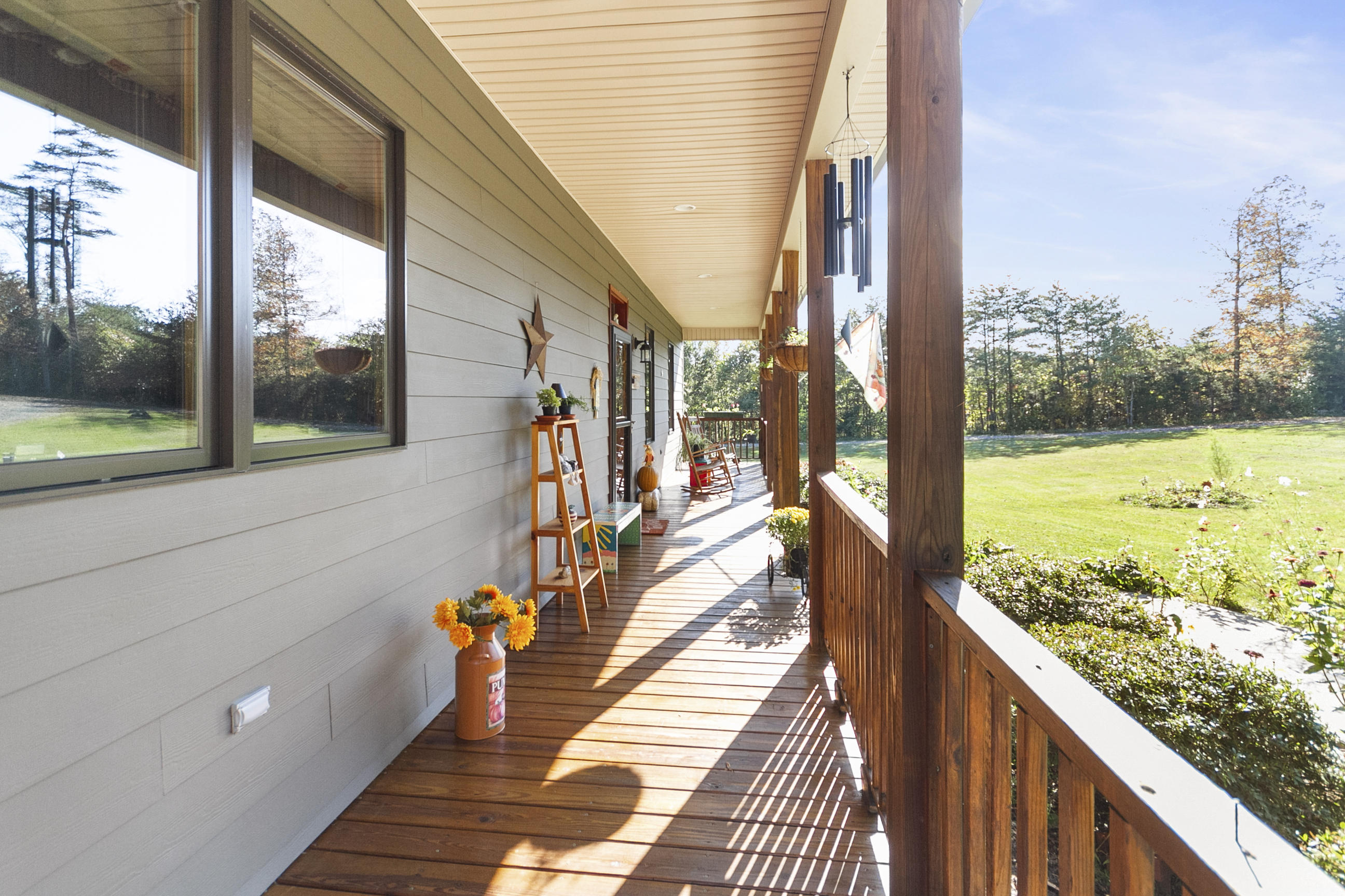 3950 Flatwoods Road Elliston, VA 24087 - Photo 12 of 94 a view of a balcony with wooden floor and iron stairs