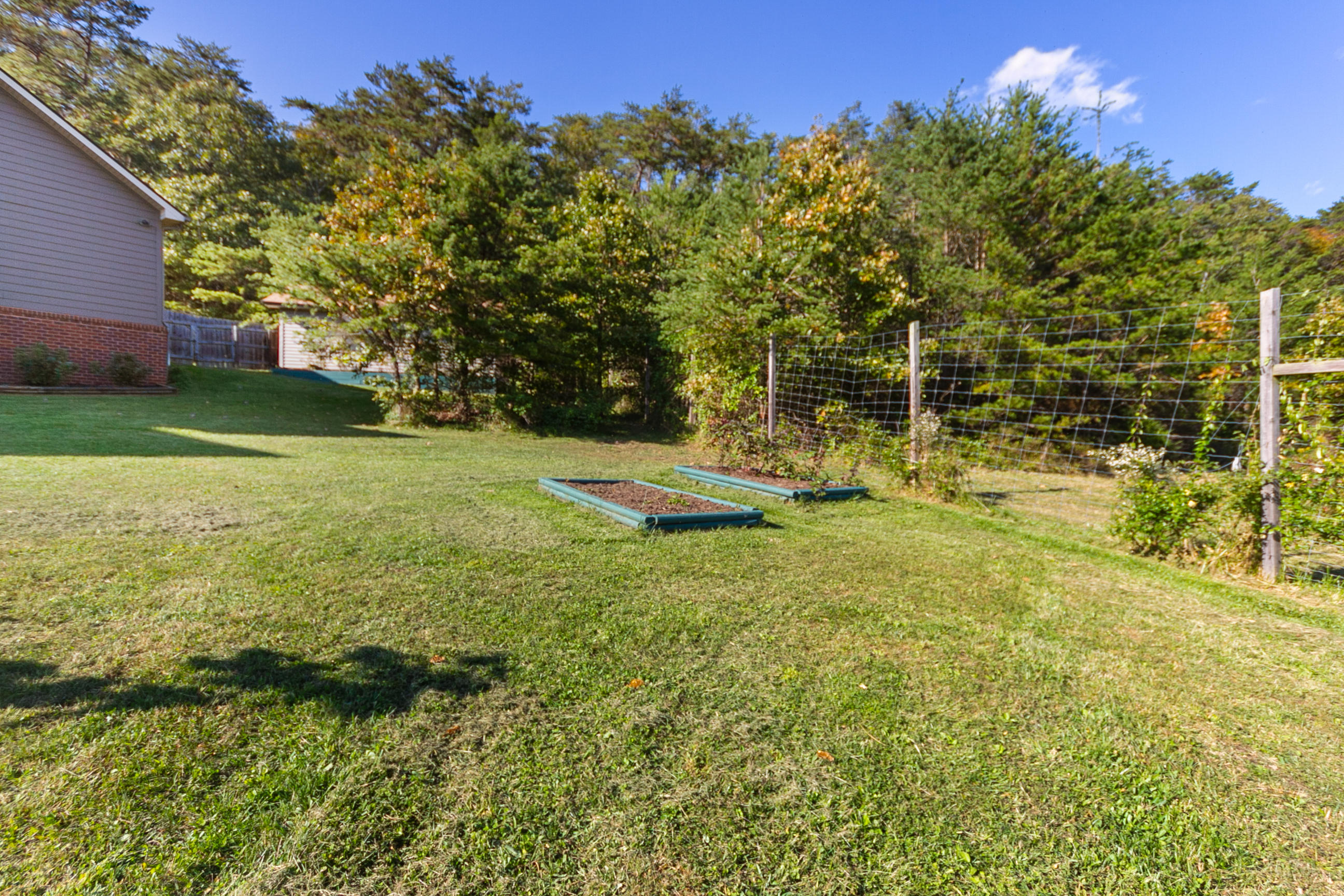 3950 Flatwoods Road Elliston, VA 24087 - Photo 4 of 94 a backyard of a house with lots of green space