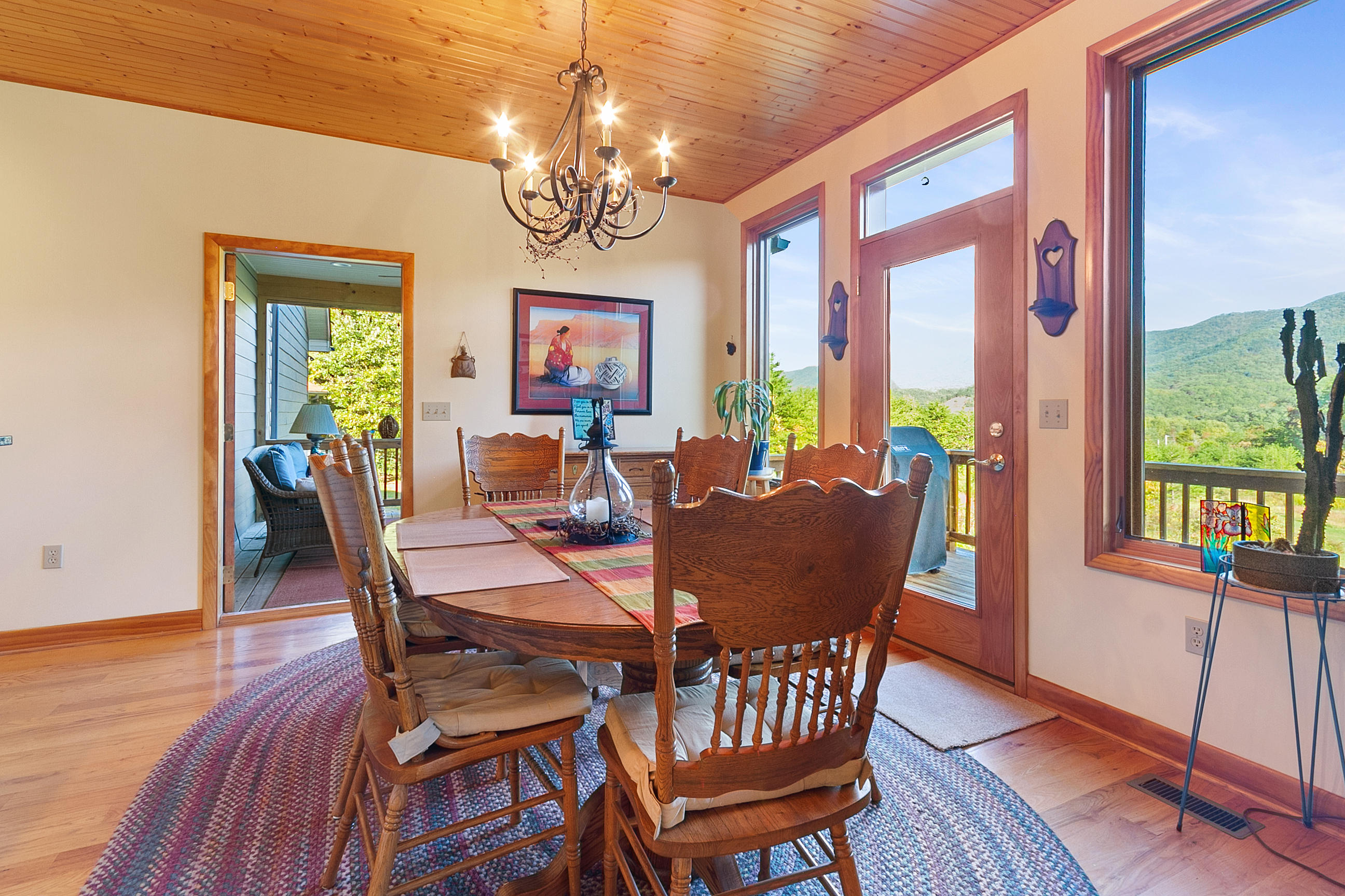 3950 Flatwoods Road Elliston, VA 24087 - Photo 35 of 94 a view of a dining room with furniture a chandelier and wooden floor
