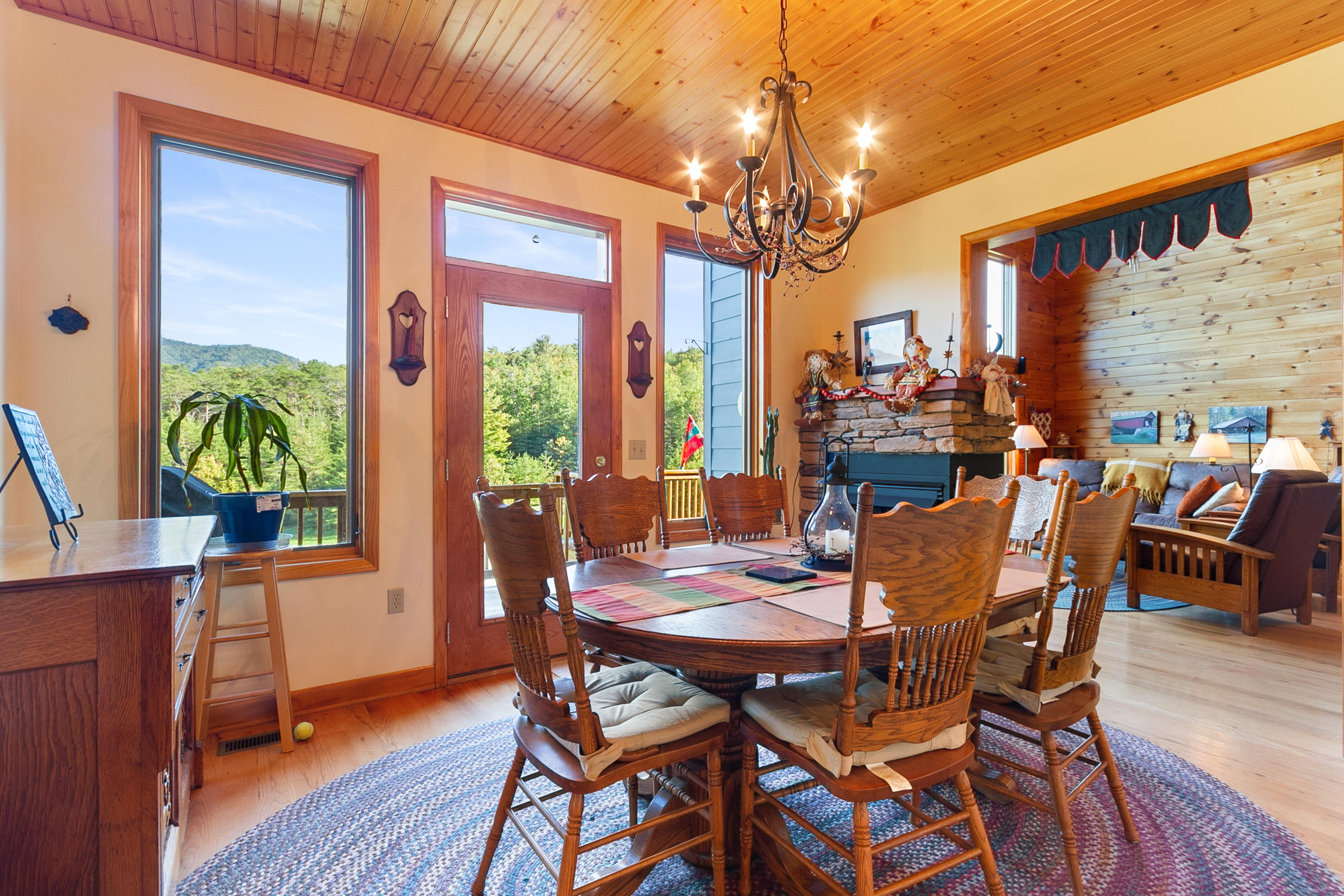 3950 Flatwoods Road Elliston, VA 24087 - Photo 36 of 94 a view of a dining room with furniture a chandelier and wooden floor