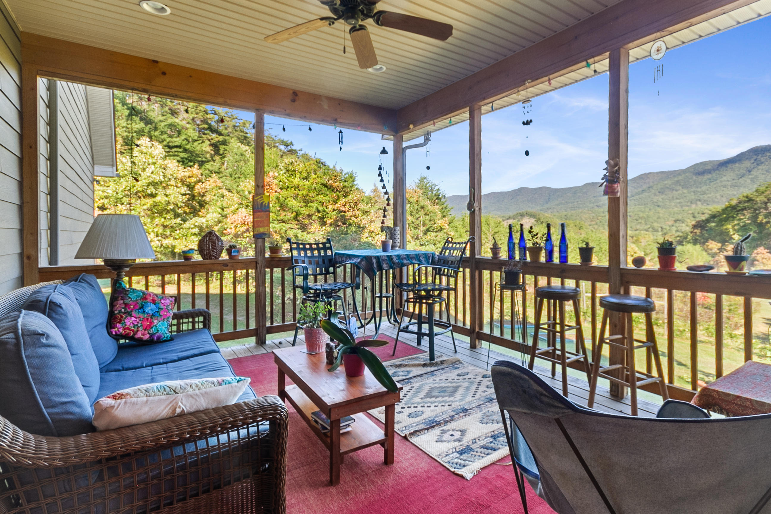 3950 Flatwoods Road Elliston, VA 24087 - Photo 38 of 94 a living room with furniture tv and a large window