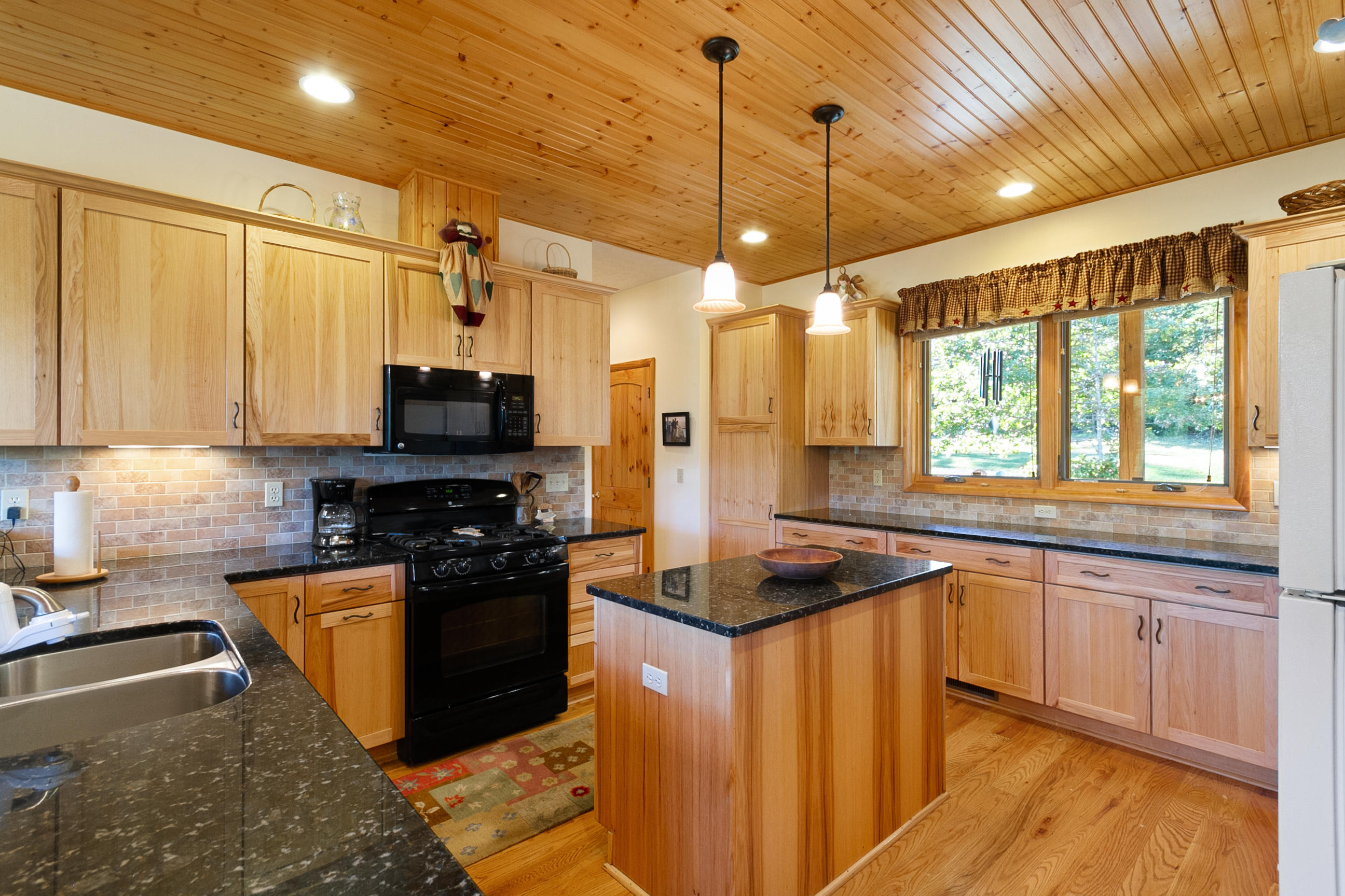 3950 Flatwoods Road Elliston, VA 24087 - Photo 44 of 94 a kitchen with stainless steel appliances granite countertop a sink stove and refrigerator