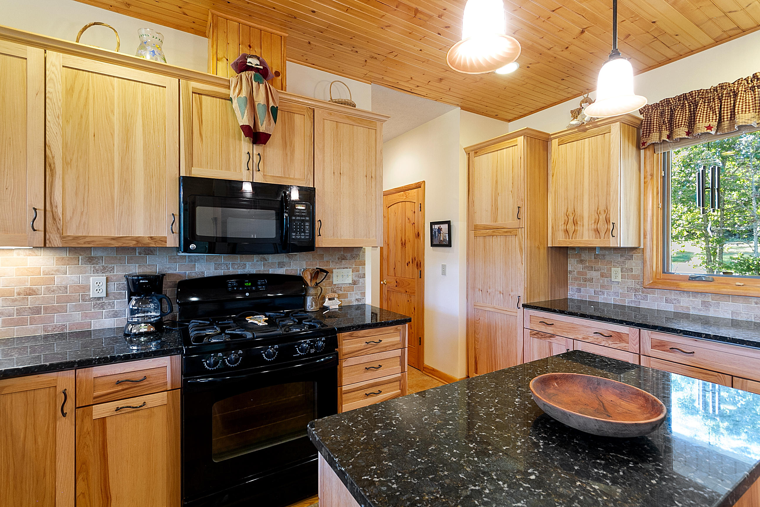 3950 Flatwoods Road Elliston, VA 24087 - Photo 45 of 94 a kitchen with stainless steel appliances granite countertop a sink a stove and a refrigerator