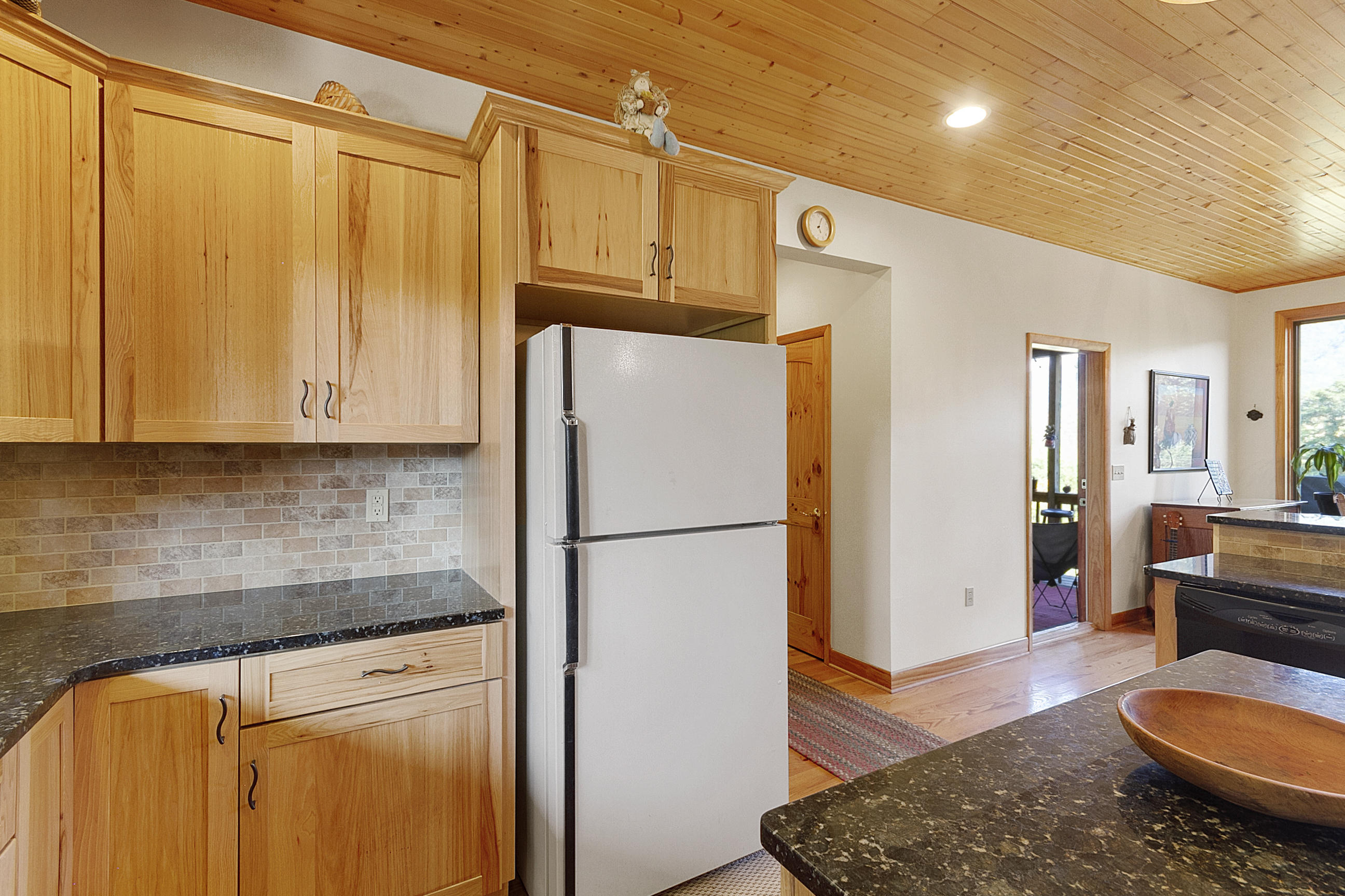 3950 Flatwoods Road Elliston, VA 24087 - Photo 48 of 94 a kitchen with stainless steel appliances granite countertop a refrigerator a sink and dishwasher with wooden floor