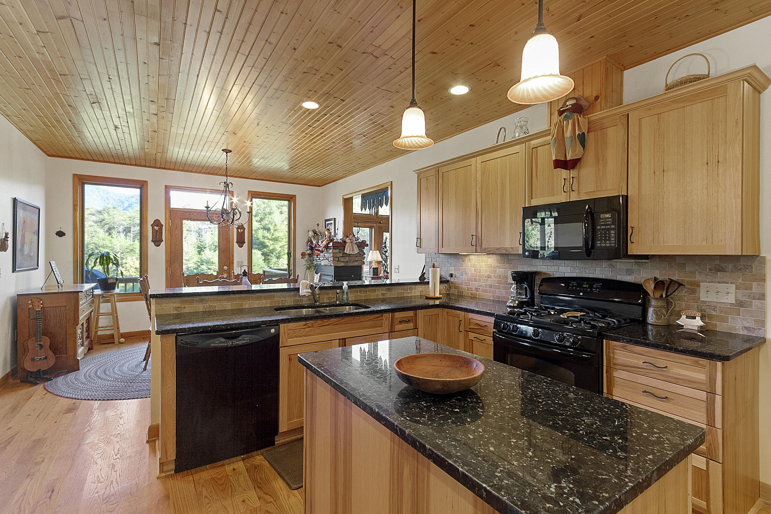3950 Flatwoods Road Elliston, VA 24087 - Photo 49 of 94 a kitchen with stainless steel appliances granite countertop a sink stove and cabinets
