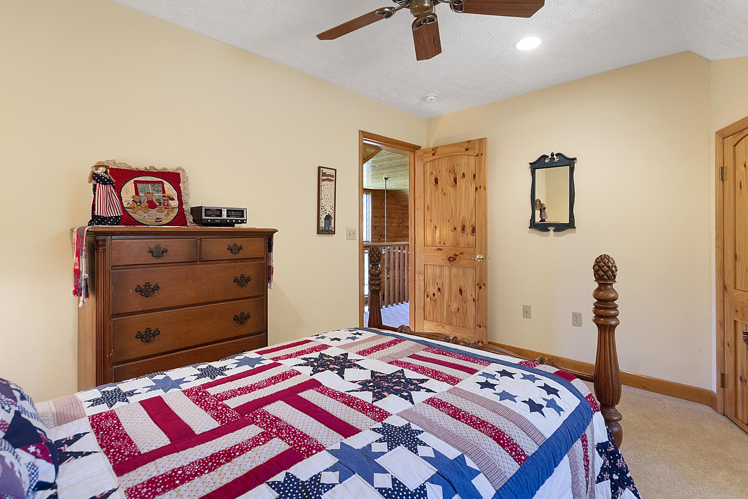 3950 Flatwoods Road Elliston, VA 24087 - Photo 59 of 94 a bedroom with a bed and a dresser in it