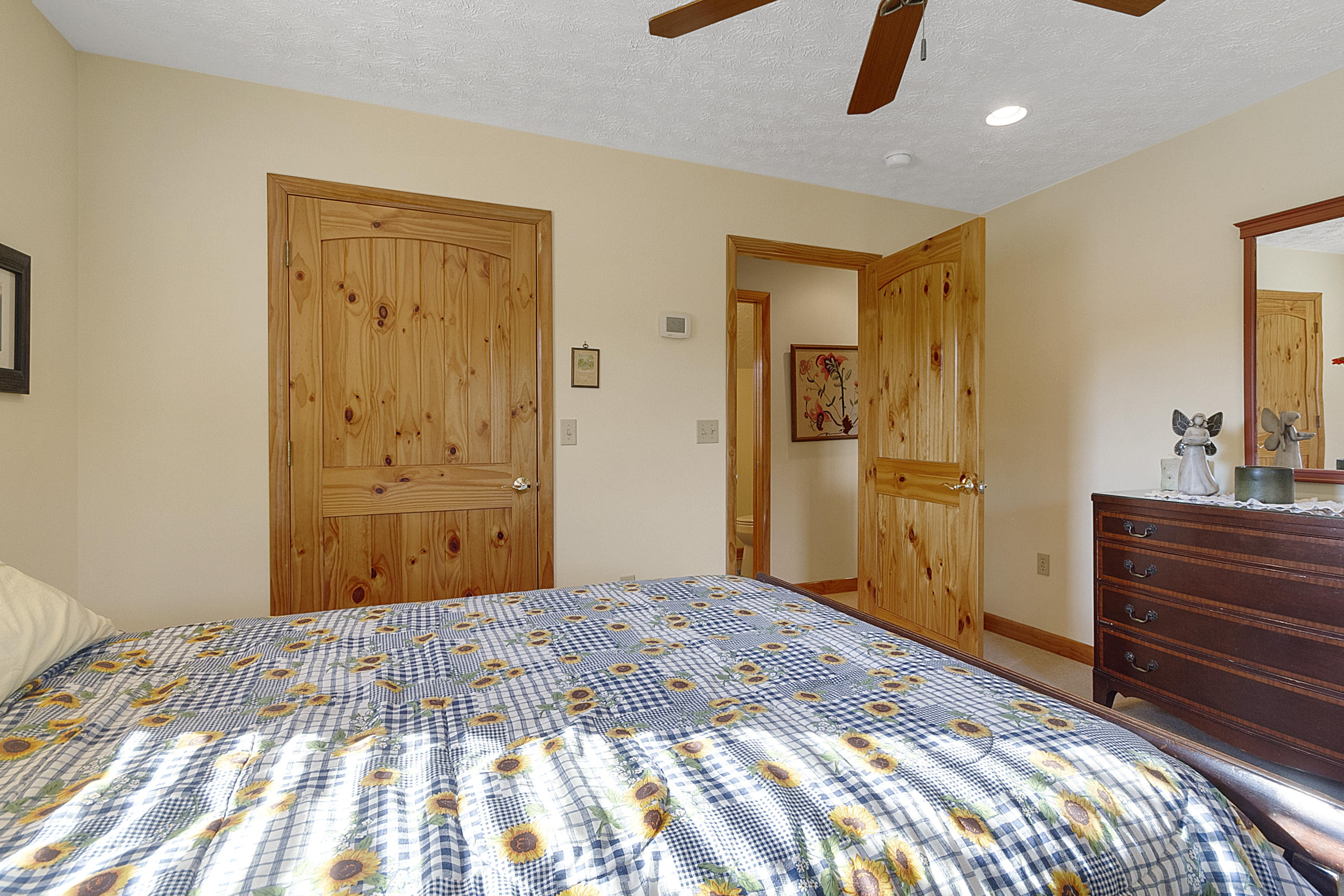 3950 Flatwoods Road Elliston, VA 24087 - Photo 62 of 94 a bedroom with a bed and a dresser