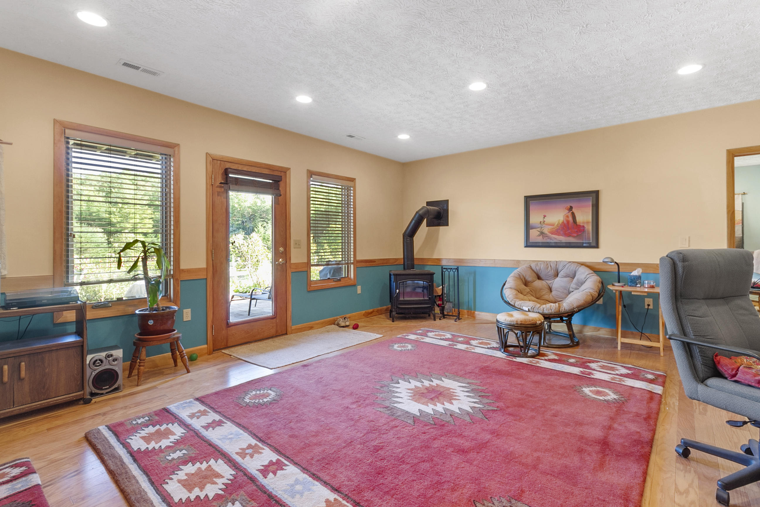 3950 Flatwoods Road Elliston, VA 24087 - Photo 65 of 94 a living room with furniture a rug and a large window