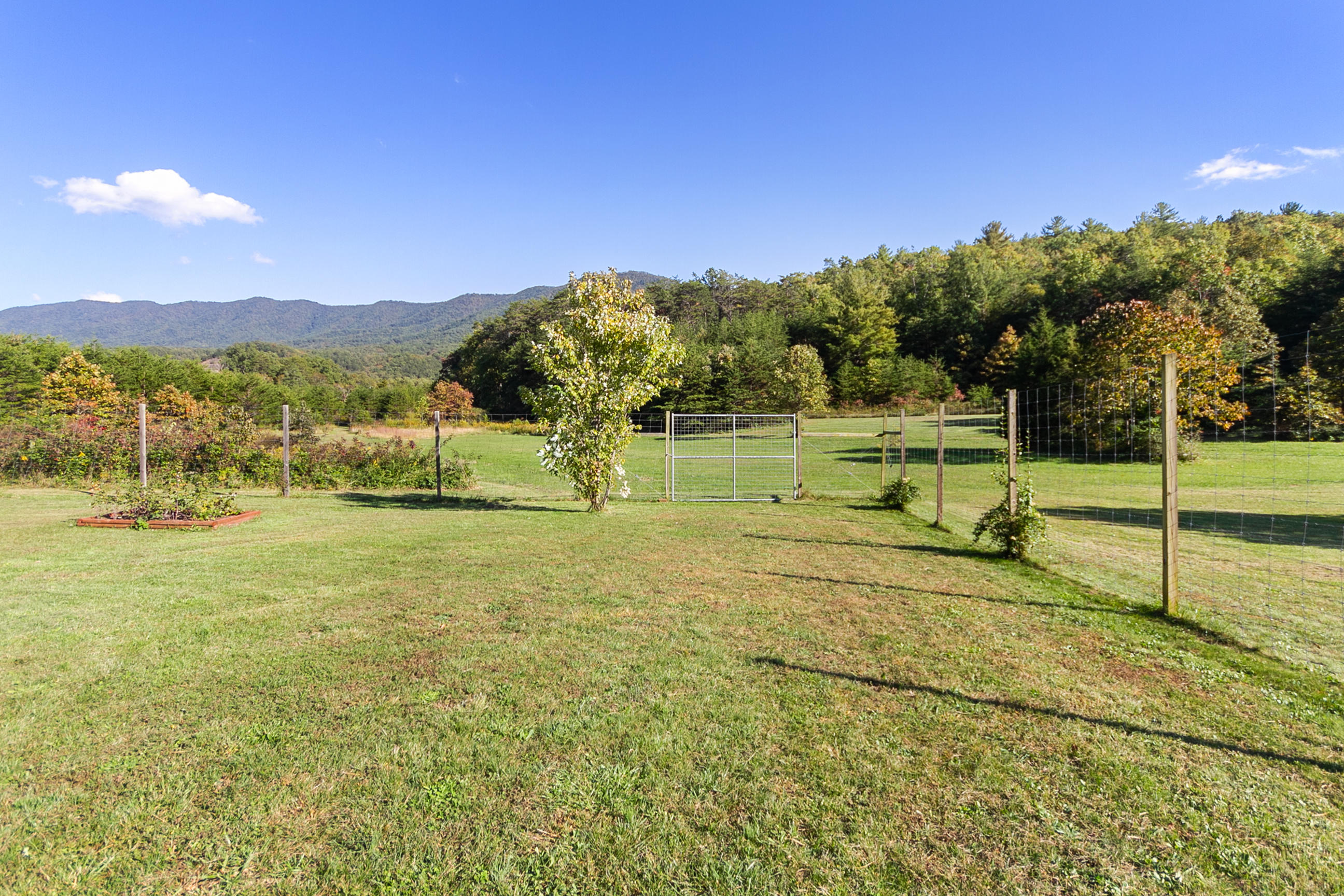 3950 Flatwoods Road Elliston, VA 24087 - Photo 9 of 94 a view of a playground with a garden