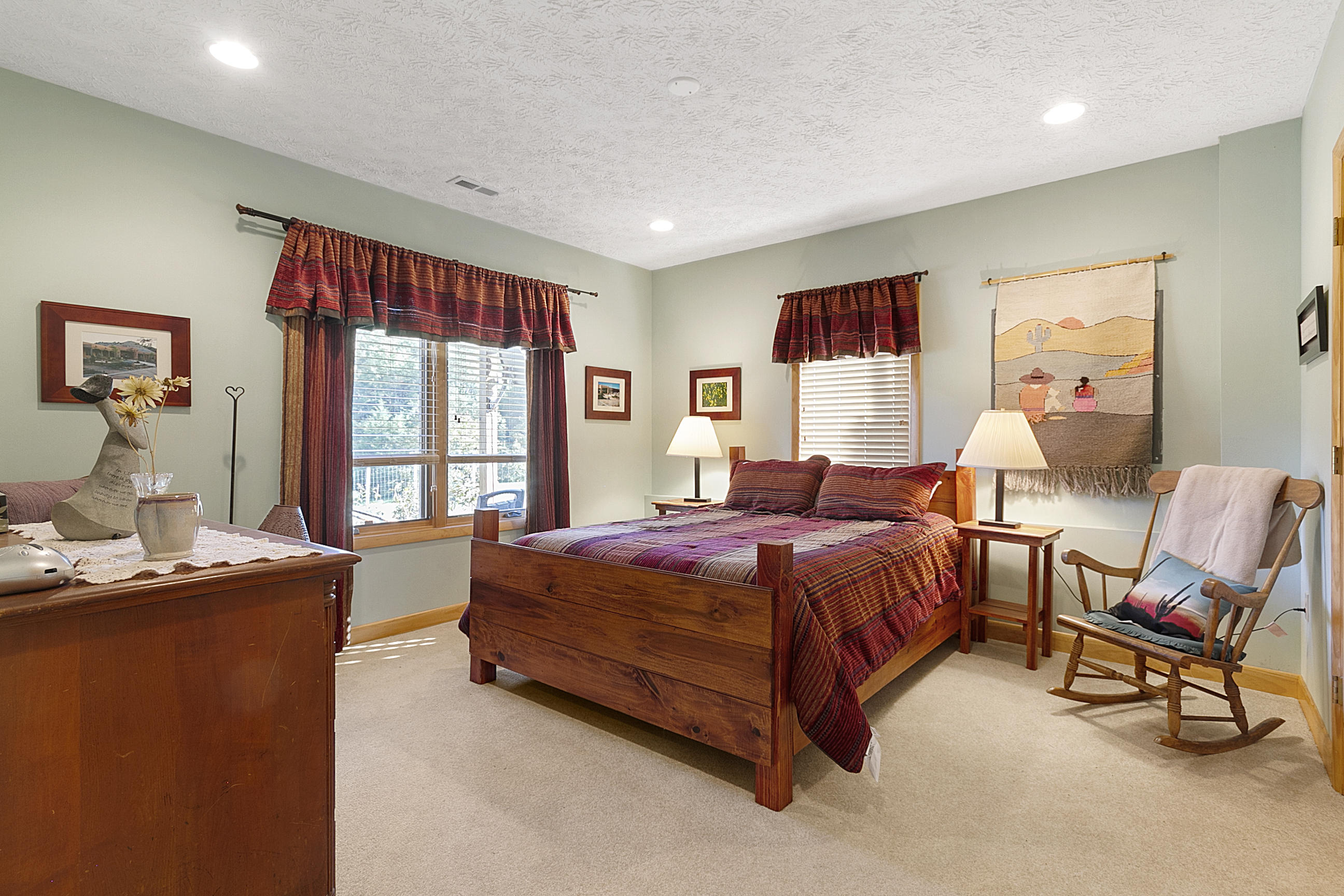 3950 Flatwoods Road Elliston, VA 24087 - Photo 83 of 94 a spacious bedroom with a bed and large windows